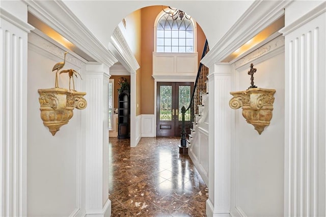 2924 Riverview Pointe Dr S, Theodore, AL 36582 - entryway featuring a decorative wall, dark marble finish flooring, wainscoting, decorative columns, and arched walkways