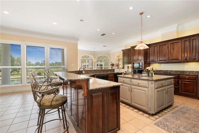 2924 Riverview Pointe Dr S, Theodore, AL 36582 - kitchen featuring a large island, built in microwave, light tile patterned floors, ornamental molding, and black dishwasher