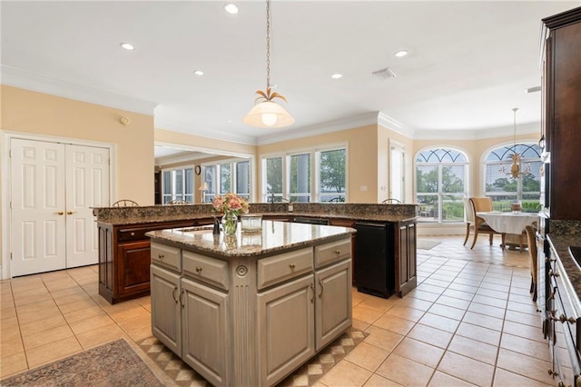 2924 Riverview Pointe Dr S, Theodore, AL 36582 - kitchen featuring a center island, crown molding, light tile patterned floors, pendant lighting, and recessed lighting