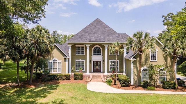 2924 Riverview Pointe Dr S, Theodore, AL 36582 - neoclassical home featuring stucco siding, a front yard, french doors, and roof with shingles
