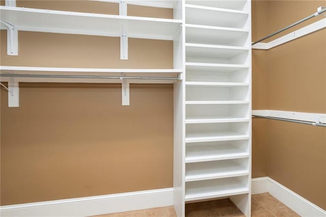 2924 Riverview Pointe Dr S, Theodore, AL 36582 - walk in closet featuring tile patterned flooring