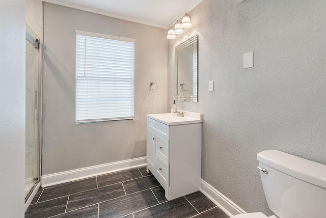 bathroom featuring vanity, toilet, and walk in shower