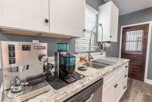 kitchen featuring white cabinetry, sink, dark wood-type flooring, and light stone countertops