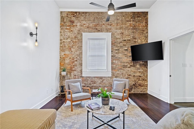 204 Conti St Unit 1A, Mobile, AL 36602 - living room featuring wood finished floors, ceiling fan, baseboards, and ornamental molding
