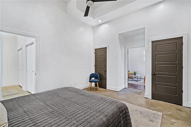 204 Conti St Unit 1A, Mobile, AL 36602 - bedroom with a towering ceiling, concrete floors, baseboards, recessed lighting, and ceiling fan