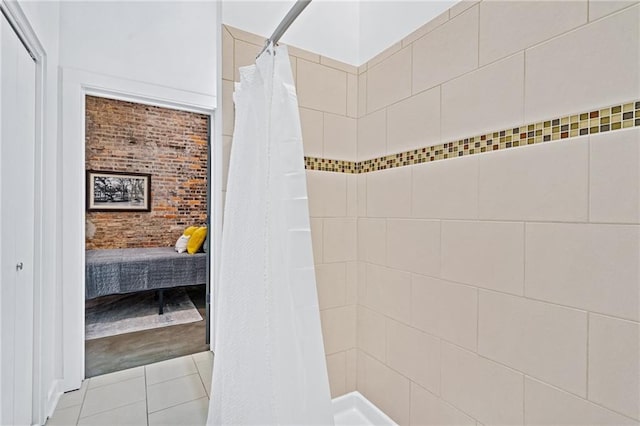 204 Conti St Unit 1A, Mobile, AL 36602 - ensuite bathroom featuring a tile shower and tile patterned flooring