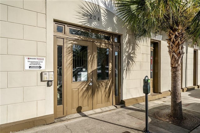 204 Conti St Unit 1A, Mobile, AL 36602 - doorway to property with concrete block siding