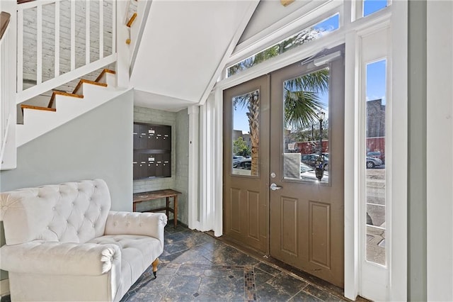 204 Conti St Unit 1A, Mobile, AL 36602 - entrance foyer with stone tile floors and stairs