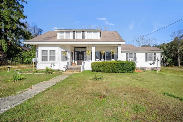 bungalow-style house featuring cooling unit, a front lawn, and covered porch