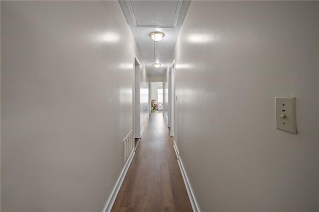 18141 Pennsylvania St, Robertsdale, AL 36567 - hallway featuring attic access, baseboards, visible vents, and dark wood-style flooring