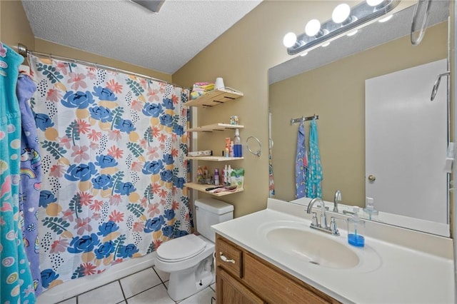 18141 Pennsylvania St, Robertsdale, AL 36567 - bathroom with a textured ceiling, vanity, a shower with curtain, tile patterned flooring, and toilet