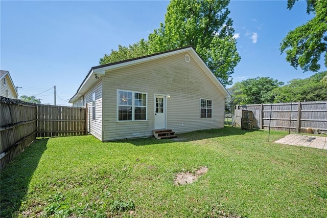 18141 Pennsylvania St, Robertsdale, AL 36567 - rear view of property featuring entry steps, a yard, and a fenced backyard