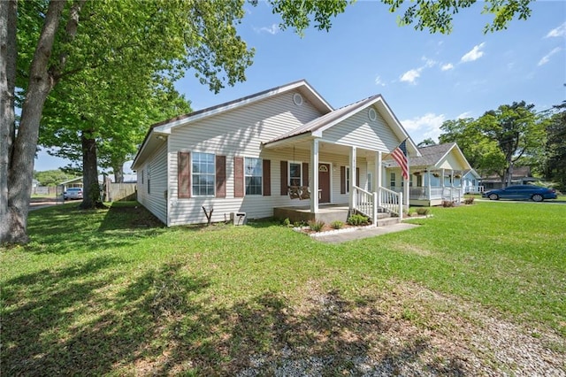 18141 Pennsylvania St, Robertsdale, AL 36567 - back of property with a yard and covered porch