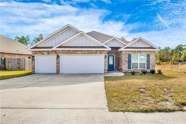 craftsman-style house with a garage and a front lawn