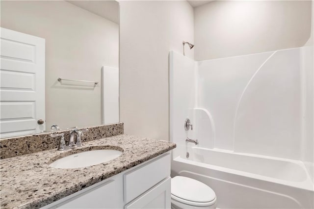 full bathroom featuring vanity, toilet, and washtub / shower combination