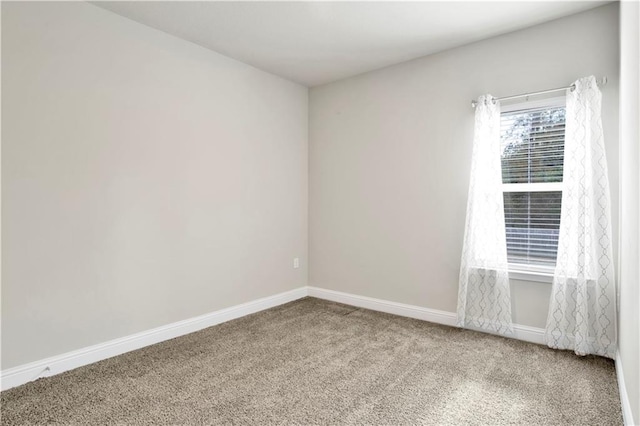 unfurnished room featuring carpet flooring