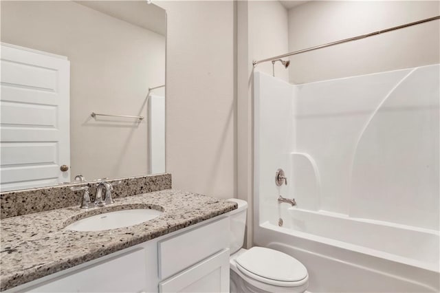 full bathroom featuring vanity, shower / bathtub combination, and toilet