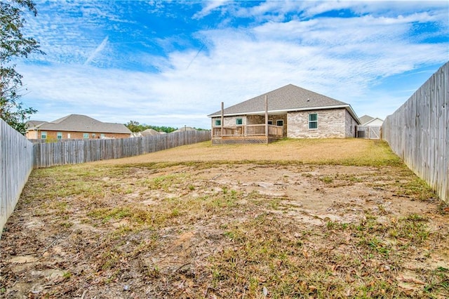 view of yard featuring a wooden deck