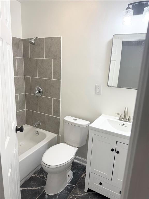 full bathroom featuring vanity, marble finish floor, toilet, and shower / washtub combination