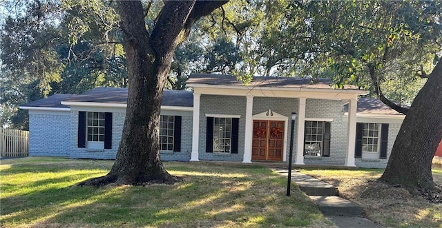 ranch-style house with a front lawn