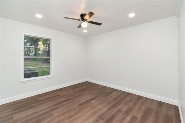 empty room featuring ceiling fan, ornamental molding, and dark hardwood / wood-style flooring