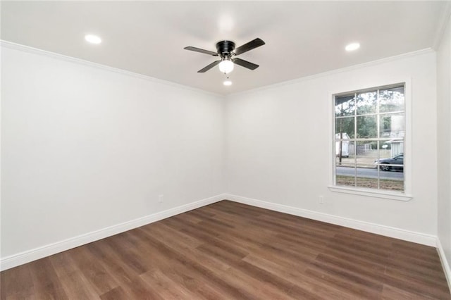 empty room featuring ornamental molding, dark hardwood / wood-style floors, and ceiling fan