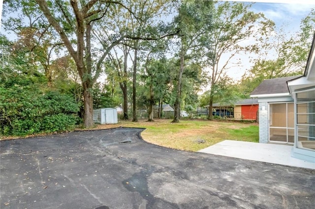 view of patio with a shed