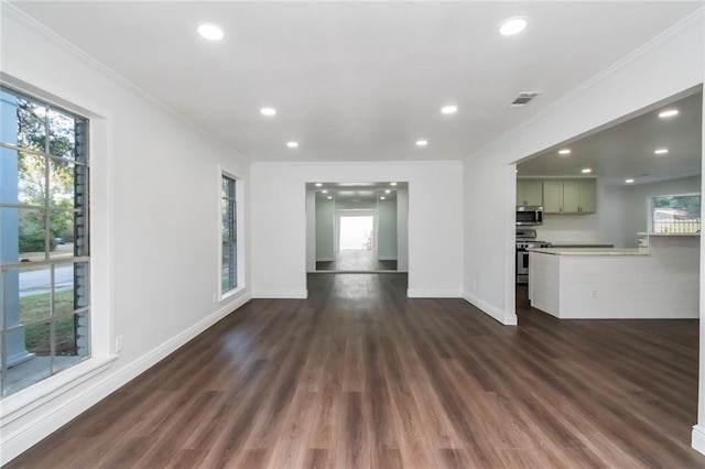 unfurnished living room featuring crown molding and dark hardwood / wood-style flooring