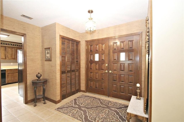 106 Windsor Ct, Daphne, AL 36526 - foyer featuring light tile patterned floors and a chandelier