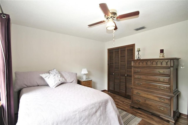 106 Windsor Ct, Daphne, AL 36526 - bedroom with dark wood-style flooring, a closet, and a ceiling fan