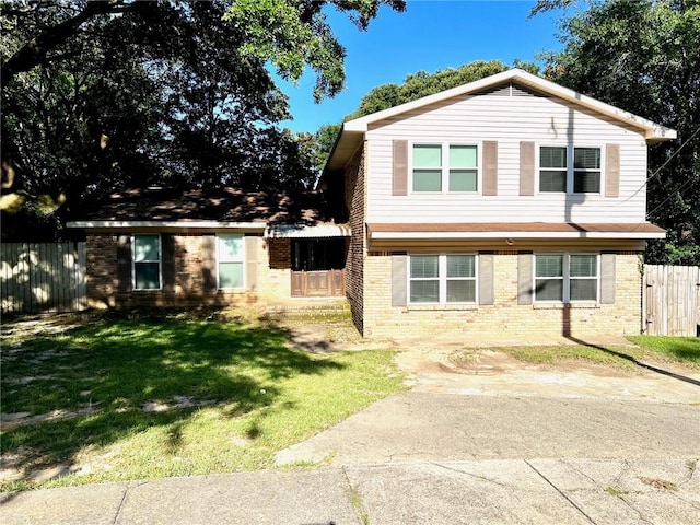 split level home with a front yard