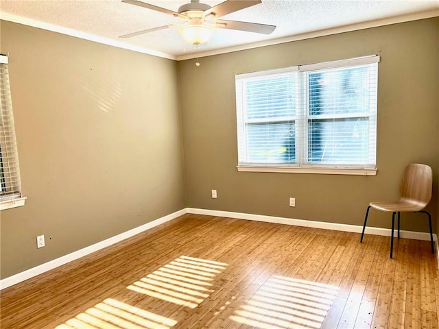 unfurnished room featuring ceiling fan, a textured ceiling, and hardwood / wood-style flooring