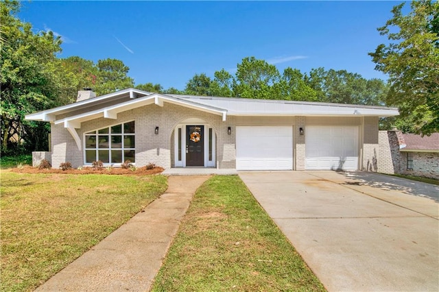 2604 Old Dobbin Dr E, Mobile, AL 36695 - mid-century inspired home with brick siding, an attached garage, driveway, a front yard, and a chimney