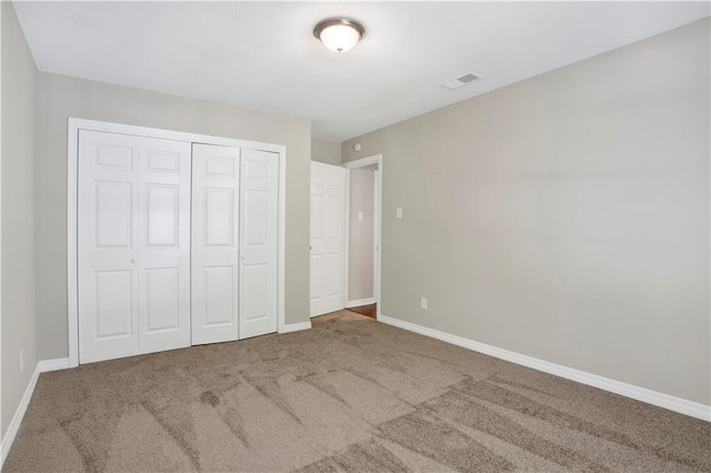 2604 Old Dobbin Dr E, Mobile, AL 36695 - unfurnished bedroom featuring carpet floors and a closet