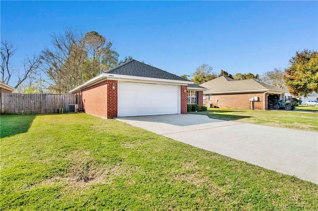 view of side of property with central AC, brick siding, a lawn, and driveway