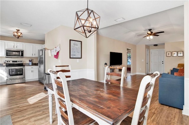 dining room featuring light wood finished floors and a ceiling fan