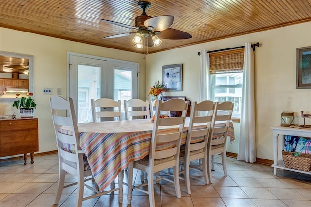 2012 Bienville Blvd, Dauphin Island, AL 36528 - dining room with healthy amount of natural light, light tile patterned floors, ceiling fan, and crown molding