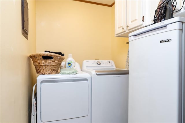 2012 Bienville Blvd, Dauphin Island, AL 36528 - washroom with washing machine and clothes dryer, cabinet space, and ornamental molding