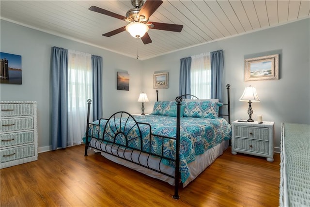 2012 Bienville Blvd, Dauphin Island, AL 36528 - bedroom with multiple windows, wood finished floors, wooden ceiling, crown molding, and a ceiling fan