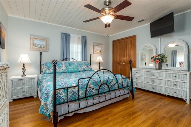 2012 Bienville Blvd, Dauphin Island, AL 36528 - bedroom featuring crown molding, wood finished floors, and ceiling fan