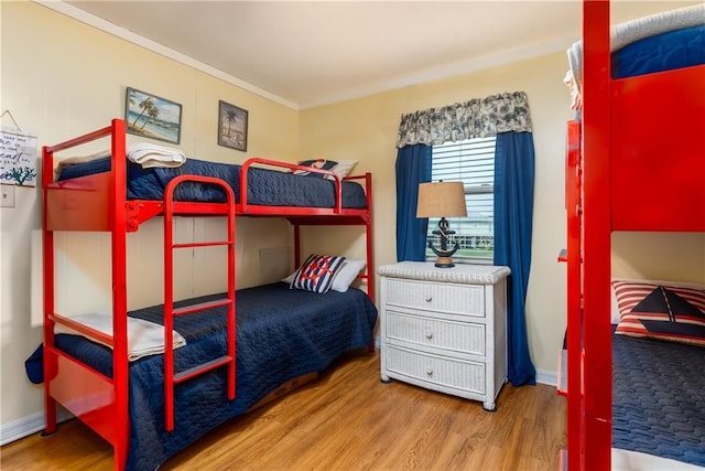 2012 Bienville Blvd, Dauphin Island, AL 36528 - bedroom featuring wood finished floors and crown molding