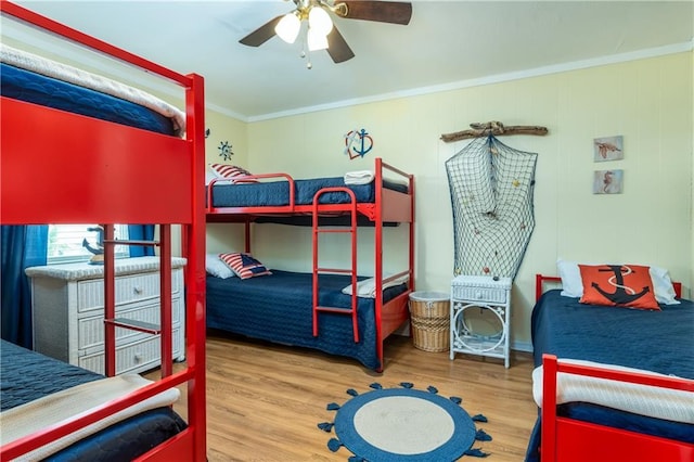 2012 Bienville Blvd, Dauphin Island, AL 36528 - bedroom featuring wood finished floors, crown molding, and a ceiling fan