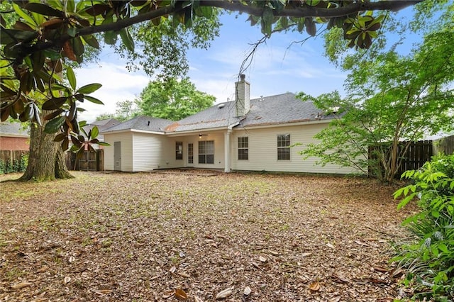 285 Portside Blvd, Mobile, AL 36695 - rear view of house featuring fence and a chimney