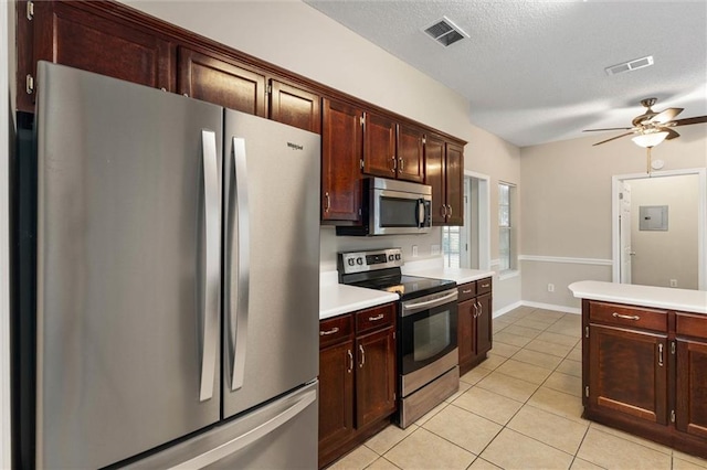 285 Portside Blvd, Mobile, AL 36695 - kitchen with stainless steel appliances, light countertops, light tile patterned flooring, ceiling fan, and a textured ceiling