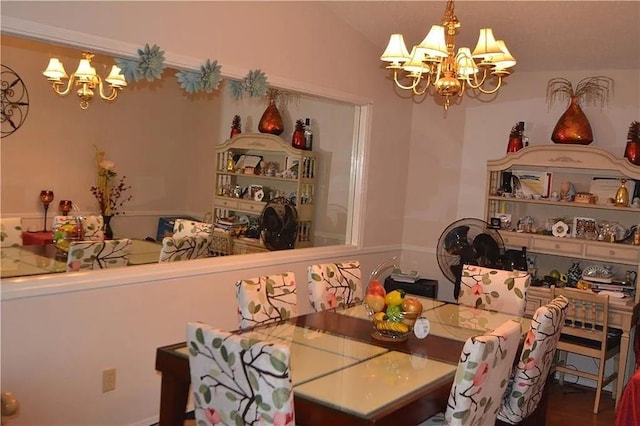 dining room featuring vaulted ceiling and a notable chandelier