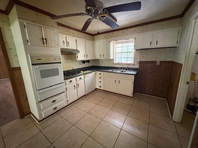 3515 York Rd, Mobile, AL 36605 - kitchen with a sink, white appliances, a warming drawer, a ceiling fan, and under cabinet range hood