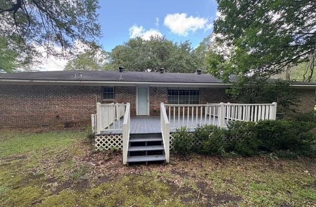 3515 York Rd, Mobile, AL 36605 - rear view of property with brick siding and a wooden deck