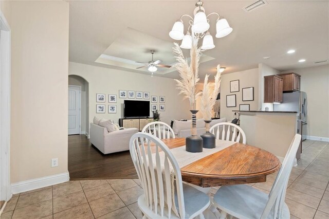 6120 Whitebark Dr, Mobile, AL 36693 - dining room featuring arched walkways, light tile patterned floors, baseboards, recessed lighting, and a ceiling fan
