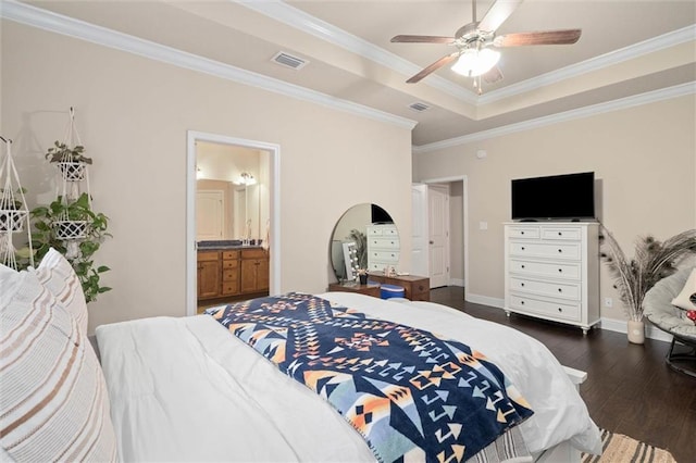 6120 Whitebark Dr, Mobile, AL 36693 - bedroom featuring dark wood-style flooring, crown molding, baseboards, a tray ceiling, and ensuite bathroom