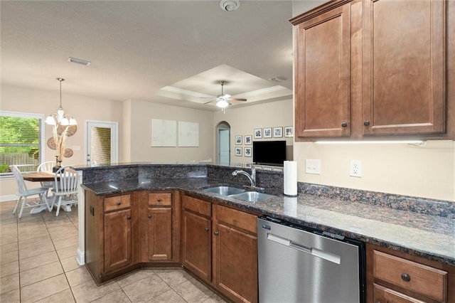 6120 Whitebark Dr, Mobile, AL 36693 - kitchen with stainless steel dishwasher, a sink, a raised ceiling, and dark stone counters